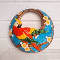 front view showing colorful parrot and floral design