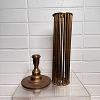 candle holder base and cage separated showing components