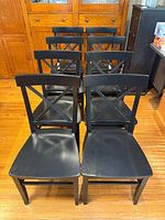 Front view of six chairs showing matching design and finish