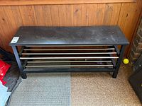 Full view of shoe rack bench front, showing top and shelves
