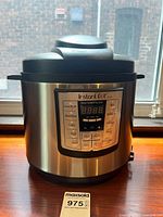 Front view showing full unit, stainless exterior, control panel, and MaxSold lot tag