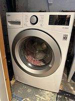 Front view of LG white front-load dryer showing door, control panel and overall condition