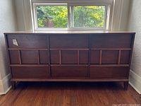 Front view showing nine drawers and two-tone design