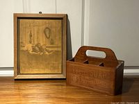 Framed sepia photo and wooden Ivory Soap caddy side by side