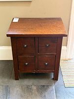 Front view showing four drawers and overall design