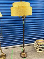 Full view of brass finish floor lamp with two-tier empire shade