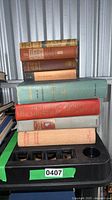 Full stack of eight vintage hardcover books