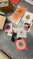 Spread of 7-inch singles with company sleeves on floor