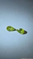 Both pear-cut yellow-green sphenes side by side