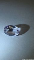 Oval faceted amethyst showing overall shape and color