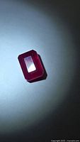 Emerald-cut ruby top view under lighting