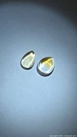 Two citrine cabochons pear and oval