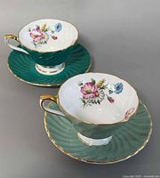 Two cups and saucers showing colour and pattern