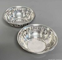 Both Birks sterling silver nut bowls top view showing size and design