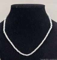 Necklace displayed on bust showing full length and bead clarity