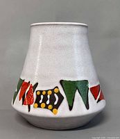 Full view front of vase showing tapered shape and geometric band