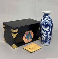 vase, box, cloth shown together