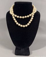 Necklace displayed on bust showing double strand arrangement