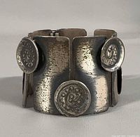 Front view showing textured sterling links and raised spiral discs