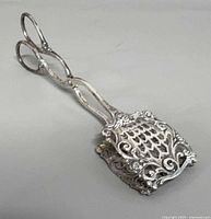 Top view of ornate 800 silver pastry tongs