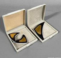 brooch and earrings inside original boxes