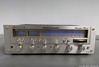 Front angled view showing faceplate, controls and illuminated dial