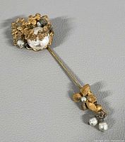 Full view of brooch showing overall design and length