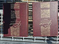 Front covers of both volumes showing titles and gilt design