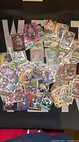 Full spread of approximately 50 NFL trading cards showing variety of sets and players