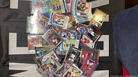 Pile view of assorted football cards showing mix of Prizm, Donruss and Wild Card releases
