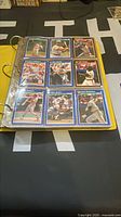 Binder page showing nine Score baseball cards