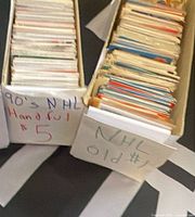 Two long boxes filled with loose hockey trading cards