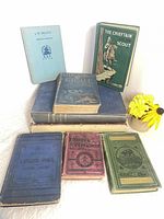 Group shot of all eight antique books