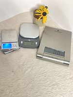 Three digital scales side by side