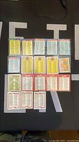 Full lot of 20 sleeved checklist cards arranged in 5×4 grid