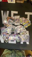 Entire lot of sleeved Vikings cards spread on table