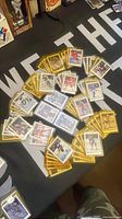 Assorted sleeved O-Pee-Chee hockey cards spread on table