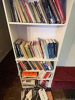 Full-height bookcase showing several shelves of the 107 reference books