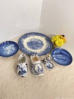 Group shot of all eight blue and white ceramic items