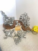 Group of five zinc ant hill sculptures displayed