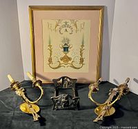 Overall lot: framed artwork, two brass sconces, brass owl bookrack