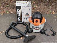 Vacuum, hose, wand, nozzle and box displayed