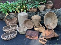 Group shot of all wicker baskets, hampers, and suitcase