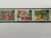 Right three stamps: carol singers, Santa, bells