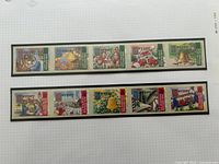 Two horizontal strips of 2003 Jersey Christmas stamps on album page