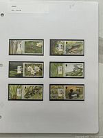 Album page with six Jersey stamps