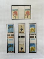 Overview of all four Australian stamp strips on album page