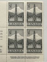 Full view of block showing four perforated stamps with attached left and bottom selvage