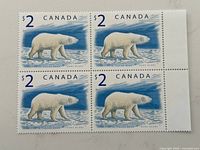 Full view of the mint block of four stamps with selvage