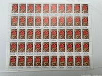 Entire full sheet of stamps displayed on flat surface